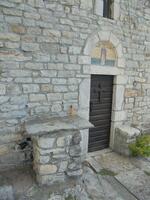 The Altar positioned Outside of the Church at the Western Wall to the Left of the Entrance